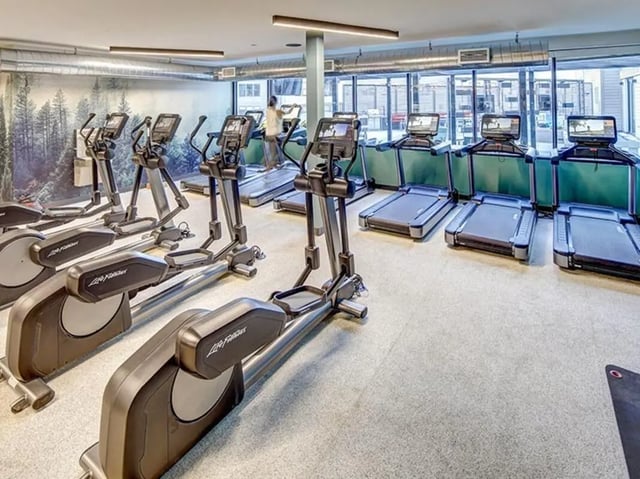 Elliptical machines and treadmills in a gym facility at The Jack in Flagstaff Student Accommodation