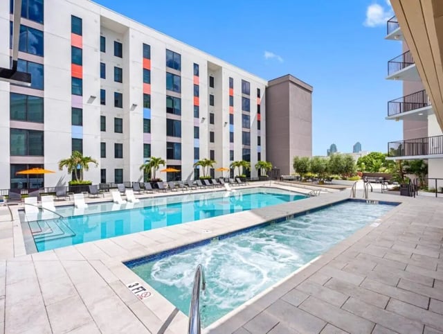Pool and hot tub with lounge chairs exterior at Apella on Newport in Tampa Student Accommodation