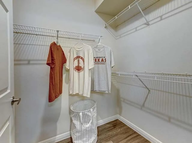 Three shirts and hamper closet area at The Block on 28th in Austin Student Accommodation