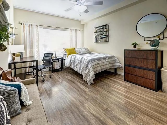 Bed desk couch and dresser Bedroom at The Block on 28th in Austin Student Accommodation