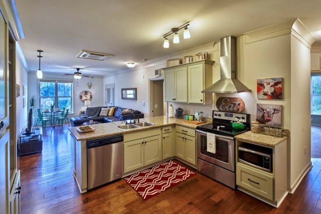 Kitchen appliances sink and cabinets living room kitchen at Arcadia Student Living in Charlotte Student Accommodation