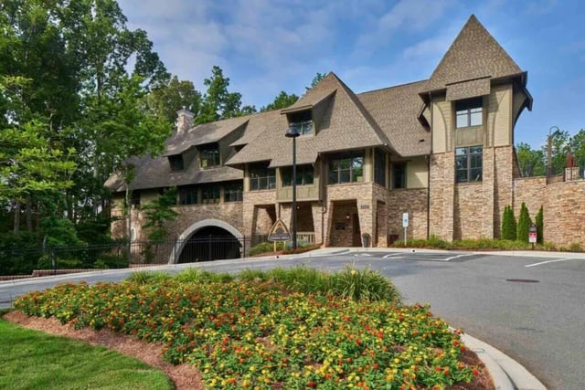 Stone building with arched entrance exterior at Arcadia Student Living in Charlotte Student Accommodation