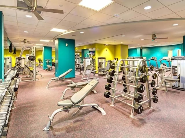 Dumbbells weight racks and benches gym area at University Crossings in Philadelphia Student Accommodation