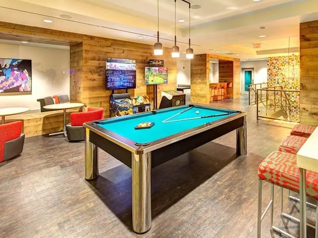 Pool table game machines seating area living room at University Crossings in Philadelphia Student Accommodation