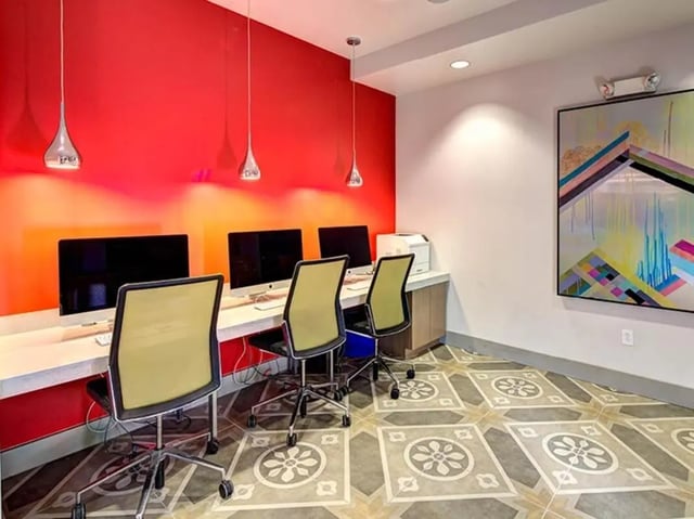 Computers printer chairs under abstract painting study area at University Crossings in Philadelphia Student Accommodation