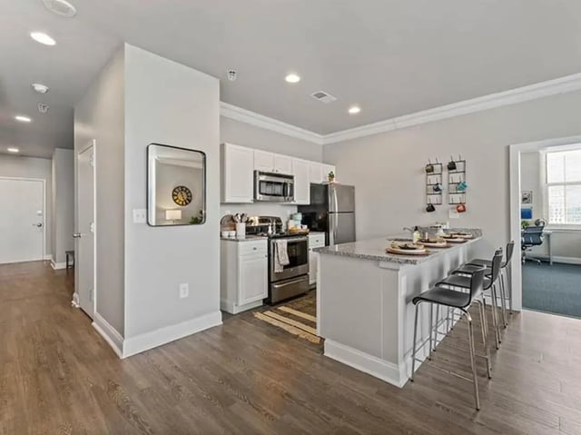 Modern kitchen with island seating and appliances kitchen at University Crossings in Philadelphia Student Accommodation
