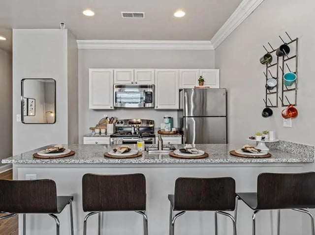 Kitchen with counter and stools kitchen at University Crossings in Philadelphia Student Accommodation