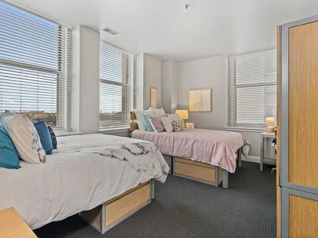 Two beds study area with desk bedroom at University Crossings in Philadelphia Student Accommodation