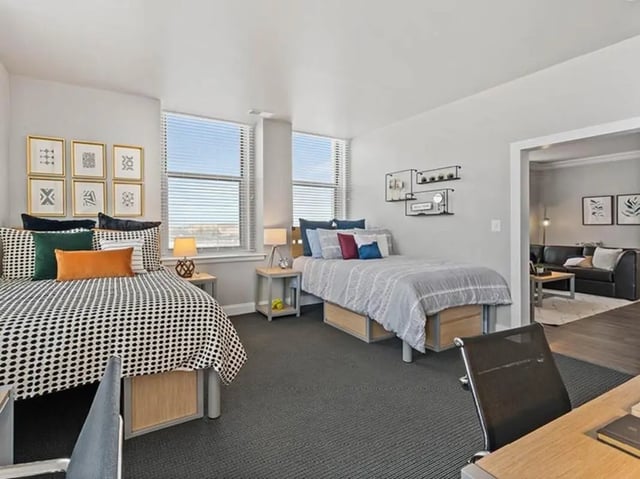 Two beds with bedside tables Bedroom at University Crossings in Philadelphia Student Accommodation
