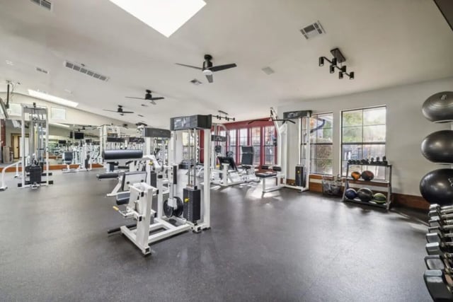 Weight machines dumbbells exercise balls gym interior at Montara Park in Norman Student Accommodation