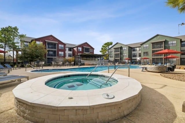 Hot tub pool volleyball court exterior at Montara Park in Norman Student Accommodation