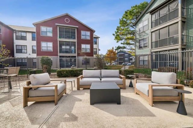 Outdoor seating area with sofas and chairs exterior at Montara Park in Norman Student Accommodation