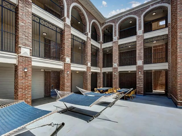 Hammocks and tables outdoor courtyard exterior at Union in Waco Student Accommodation