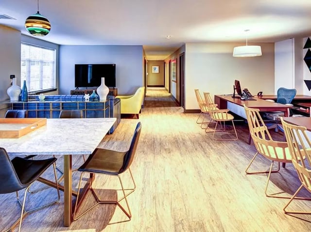 Study area with desks and chairs living area at University Crossings Charlotte in Charlotte Student Accommodation