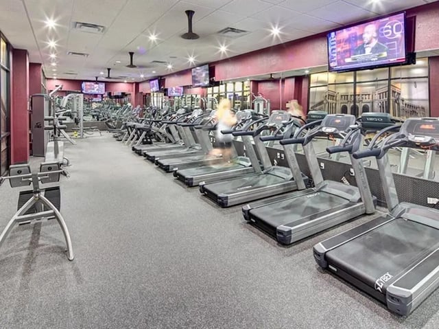 Treadmills and weight machines gym interior at The Callaway House in College Station Student Accommodation