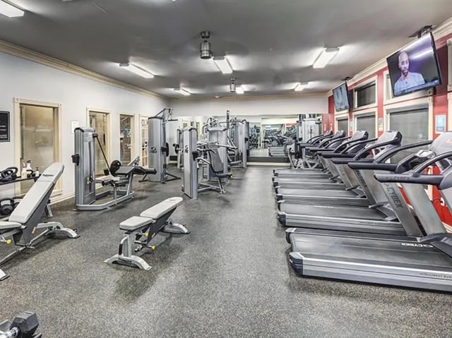 Treadmills weight machines benches exercise equipment gym at University Trails in Lubbock Student Accommodation