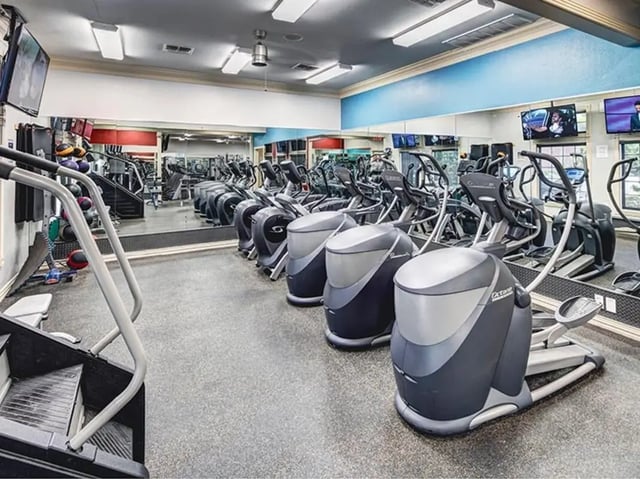Elliptical machines and stair climber gym playing area at University Trails in Lubbock Student Accommodation