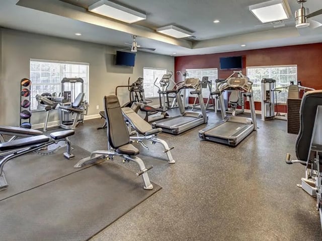 Treadmills weight benches exercise machines gym at The Village At Science Drive in Orlando Student Accommodation