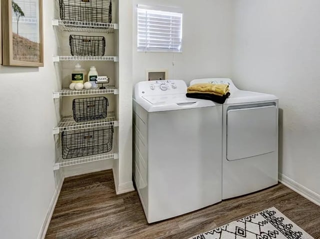 Washer dryer and shelving unit laundry area at The Village At Science Drive in Orlando Student Accommodation