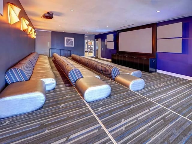 Striped seating in a media room at The Castilian in Austin Student Accommodation