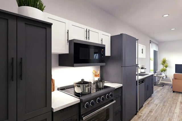 Modern kitchen with dark cabinets microwave oven and fridge Kitchen at Muse Bowling Green in Bowling Green Student Accommodation