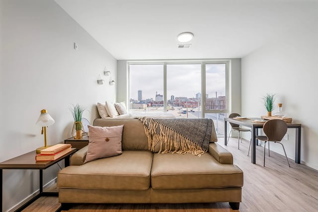 Sofa dining table and bed studio apartment at Muse Omaha in Omaha Student Accommodation
