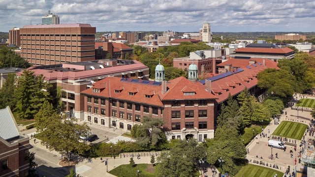 Campus buildings with red tiled roofs and green domes exterior at Six11 in Ann Arbor Student Accommodation