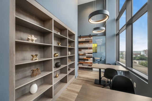Bookshelves with decor tables and chairs study area at Six11 in Ann Arbor Student Accommodation