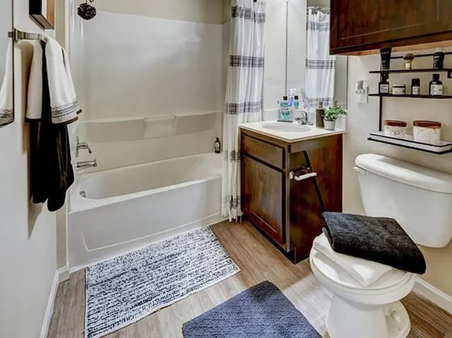 Tub vanity toilet towels bath and shower Bathroom at The Village at Overton Park in Lubbock Student Accommodation