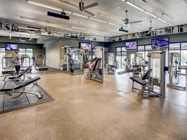 Gym equipment treadmills benches and weight machines Fitness center at The Village at Overton Park in Lubbock Student Accommodation