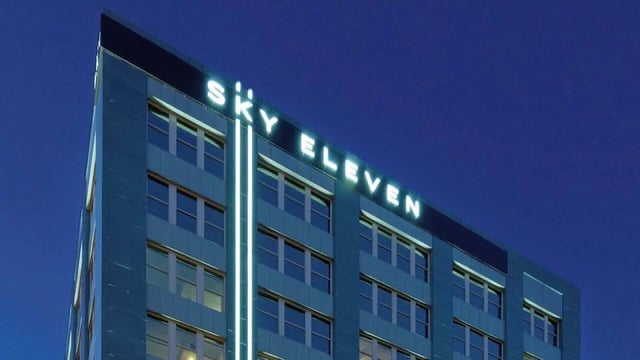 Sky Eleven building exterior with blue siding and windows at Sky Eleven in Springfield Student Accommodation