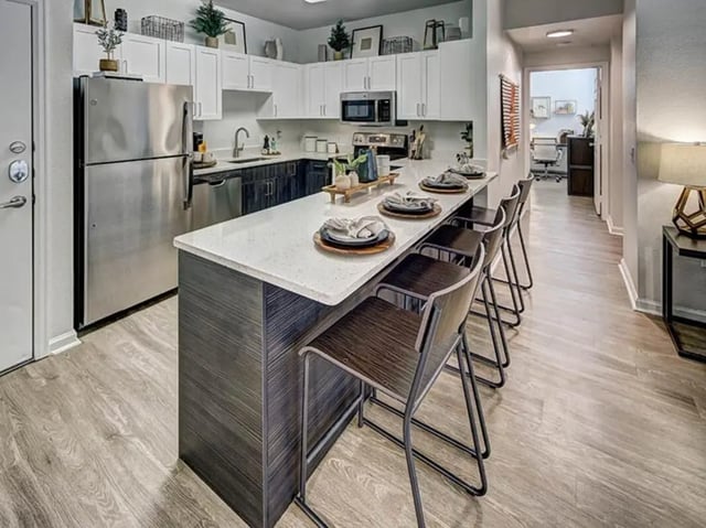 Modern kitchen with island and stools kitchen at University Village at Boulder Creek in Boulder Student Accommodation