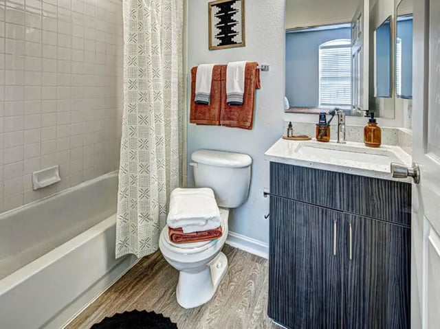 Toilet bathtub towels sink vanity bathroom at University Village at Boulder Creek in Boulder Student Accommodation