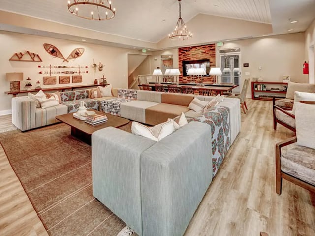 Spacious lounge area with sectional sofa and coffee table living room at University Village at Boulder Creek in Boulder Student Accommodation