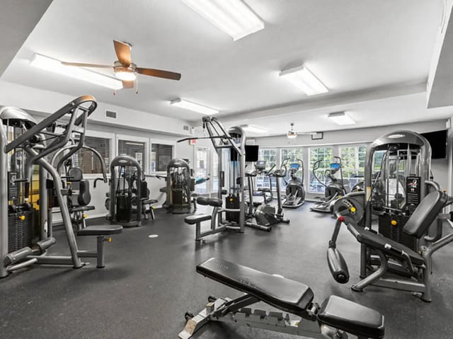 Workout machines and cardio equipment gym area at University Club Apartments in Gainesville Student Accommodation