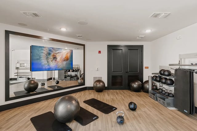 Gym equipment with exercise balls and mats playing area at Current Orlando in Orlando Student Accommodation