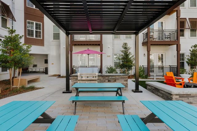 Grill area picnic tables and seating patio exterior at Current Orlando in Orlando Student Accommodation
