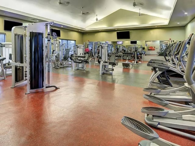 Weight machines elliptical trainers gym room at Villas at Babcock in San Antonio Student Accommodation