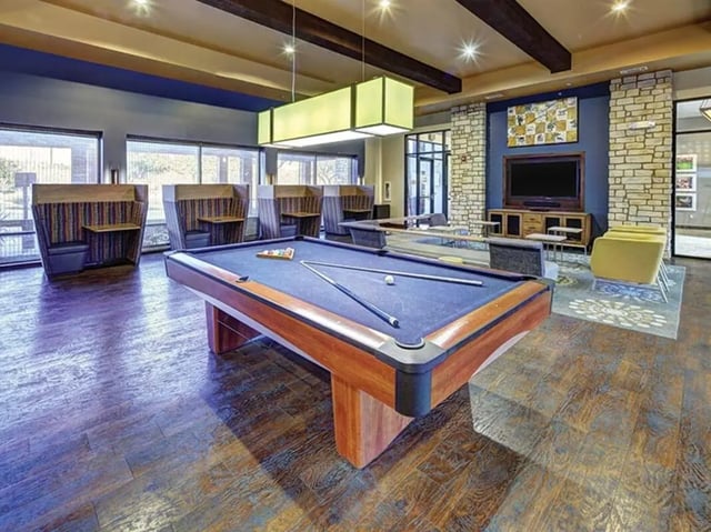 Pool table booth seating and television common area at Villas at Babcock in San Antonio Student Accommodation