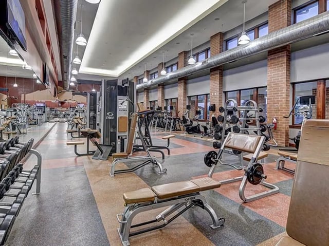 Weight machines and benches fitness gym at Villas at Chestnut Ridge in Buffalo Student Accommodation