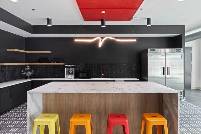 Popcorn maker microwave fridge colorful stools kitchen at Atlas Athens in Athens Student Accommodation