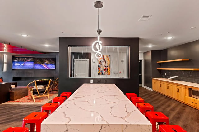 Kitchen island with red stools and modern appliances kitchen at Atlas Athens in Athens Student Accommodation