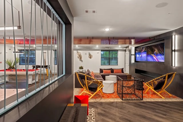 Pool table lounge area with large television and seating living room at Atlas Athens in Athens Student Accommodation
