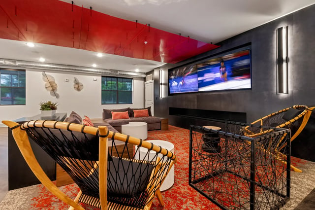 Lounge seating with large screen TV and art living room at Atlas Athens in Athens Student Accommodation