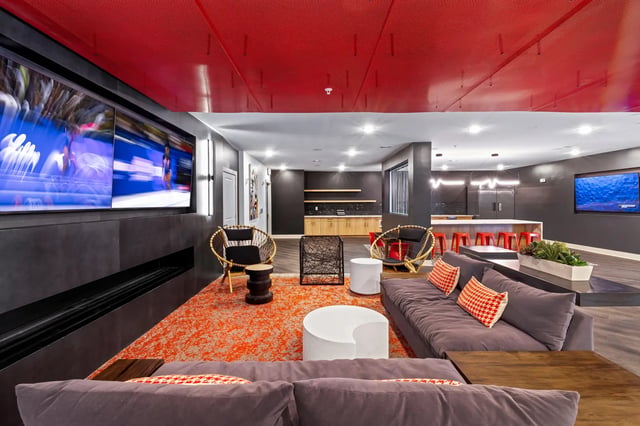 Sofas chairs tables screens and kitchen lounge at Atlas Athens in Athens Student Accommodation