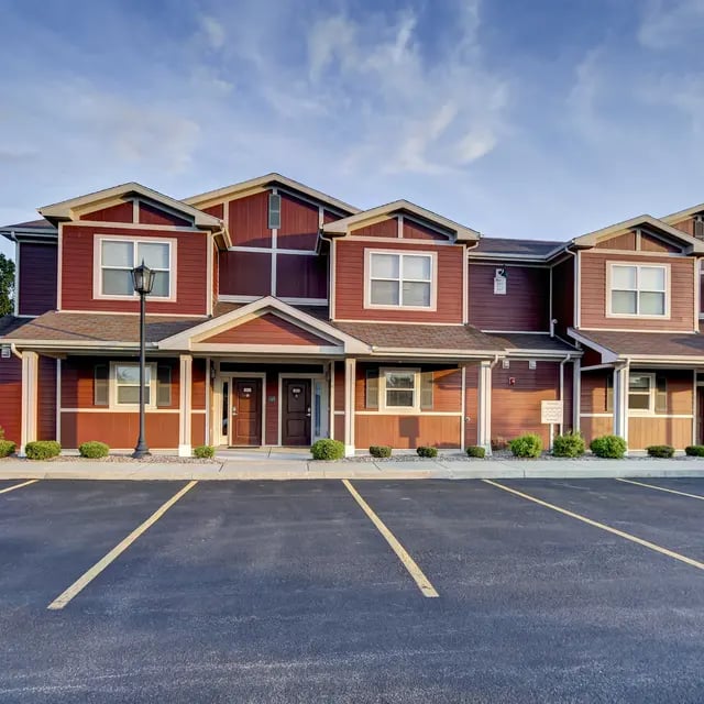 Apartment building entrance with parking lot exterior at Villas on Rensch in Buffalo Student Accommodation