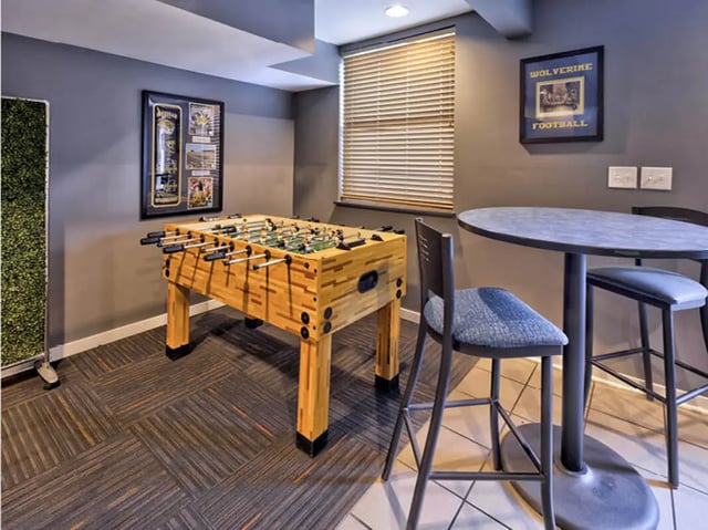 Foosball table chairs and table playing area at Willowtree Apartments & Tower in Ann Arbor Student Accommodation