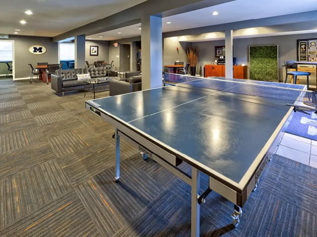 Ping pong table in common area living room at Willowtree Apartments & Tower in Ann Arbor Student Accommodation