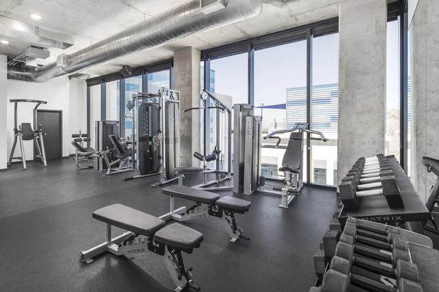 Dumbbells weight machines benches fitness gym at Atmosphere Tempe in Tempe Student Accommodation
