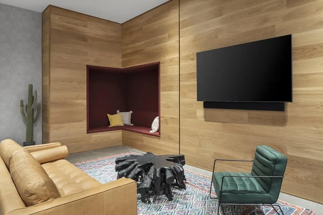 Tan sofa built in seating TV cactus rug coffee table Living room at Atmosphere Tempe in Tempe Student Accommodation